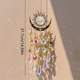 Decorative hanging ornament with crystals and celestial design on a beige background