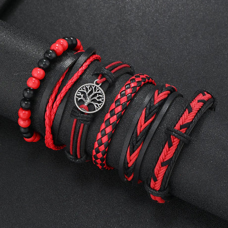Set of black and red braided bracelets on a dark background