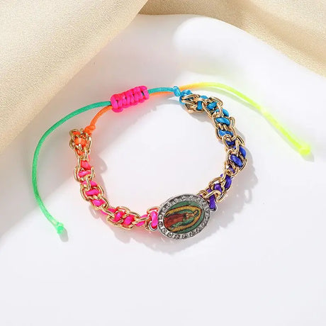 Colorful bracelet with a chain design and central emblem on a light background