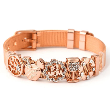 Rose gold dog collar with decorative charms on a white background
