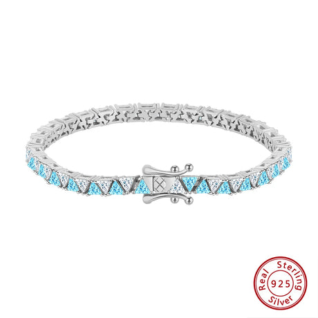 Silver bracelet with blue gemstones and a 'Real Sterling Silver' stamp on a white background