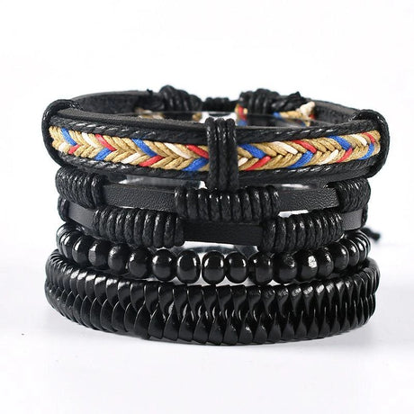 Stack of black leather and beaded bracelets with colorful braided band on a white background