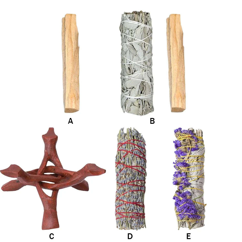 Collection of smudging tools including wooden sticks, sage bundles, and a wooden holder on a white background.