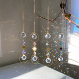 Crystal hanging decorations with rainbow折射效果 on a reflective surface