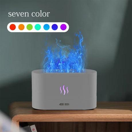 Gray electronic device with colorful flames on a wooden surface and dark background