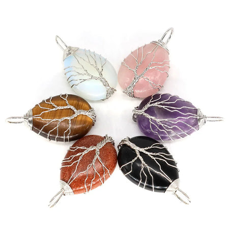 Set of six stone pendants with wire wrapping on a white background