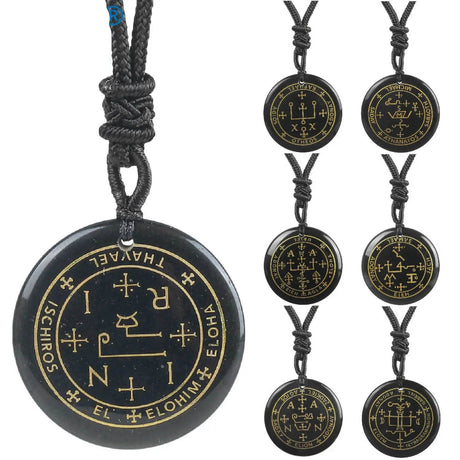 Black pendant with gold symbols on a white background, featuring the brand 'VGDS'.