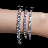 Three diamond bracelets of different widths on a wrist with size labels.