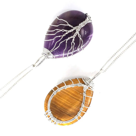 Necklace with purple and brown stone pendants on a white background
