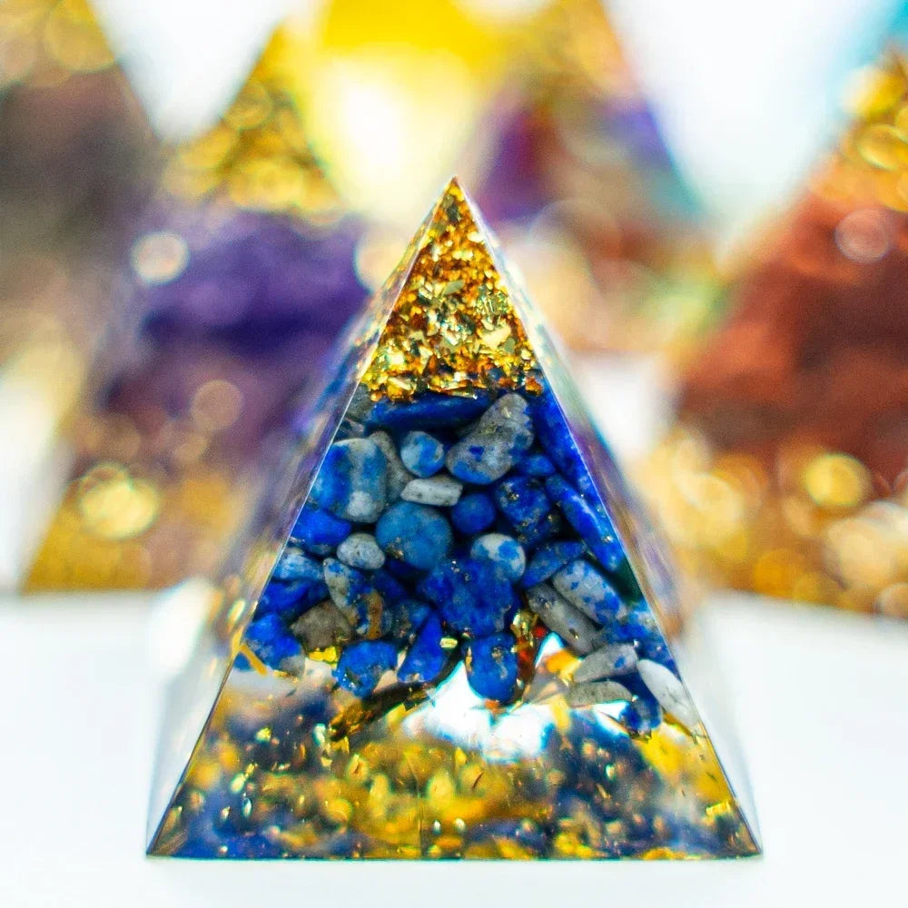 Pyramid-shaped object with blue and gold elements on a white background