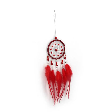 Red dreamcatcher with feathers on a white background