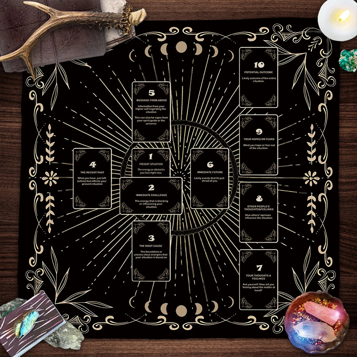 Decorative tarot card spread on a black board with gold accents, surrounded by crystals and candles.