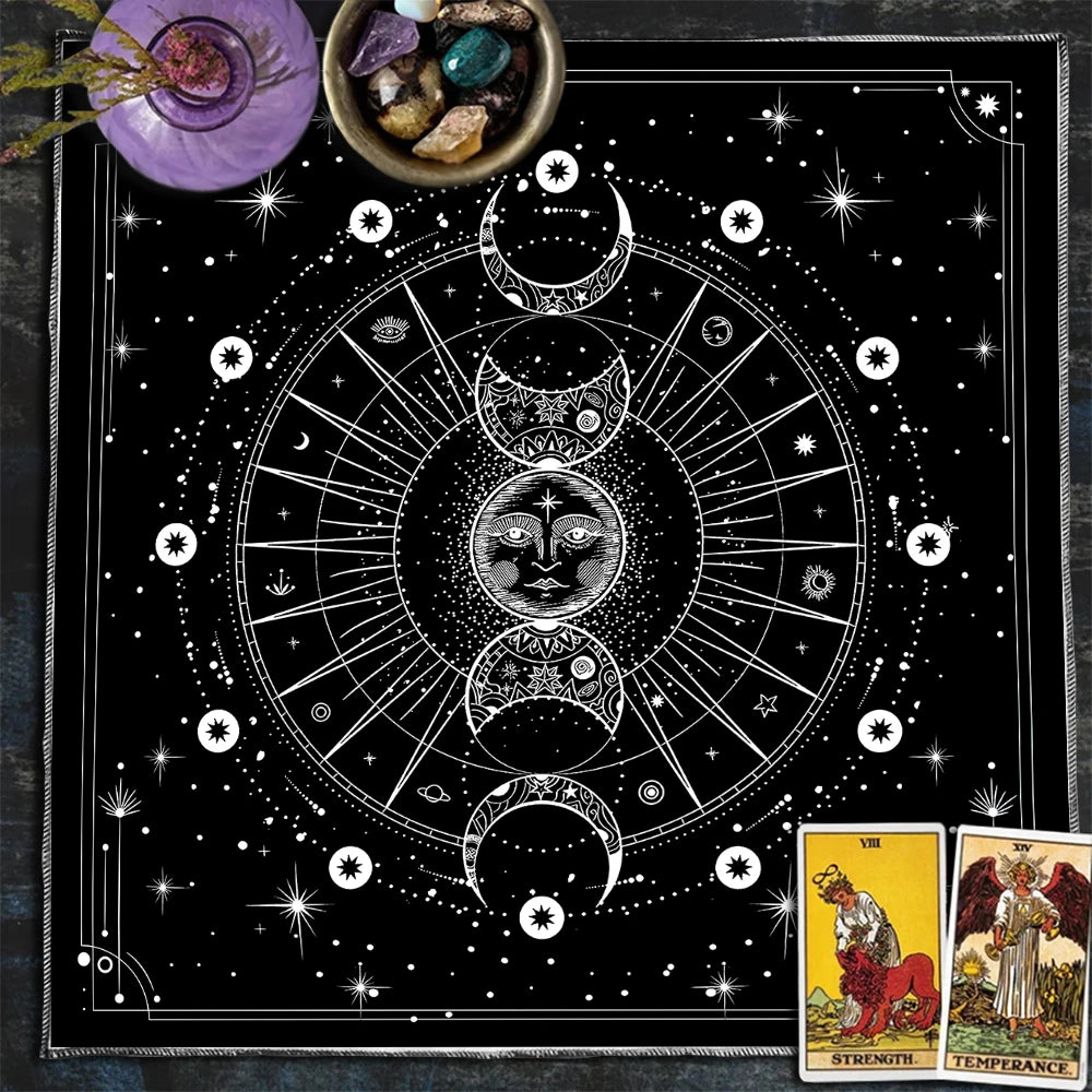 Black and white astrological design with tarot cards on a dark surface