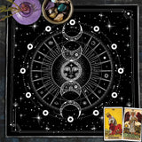 Black and white astrological design with tarot cards on a dark surface