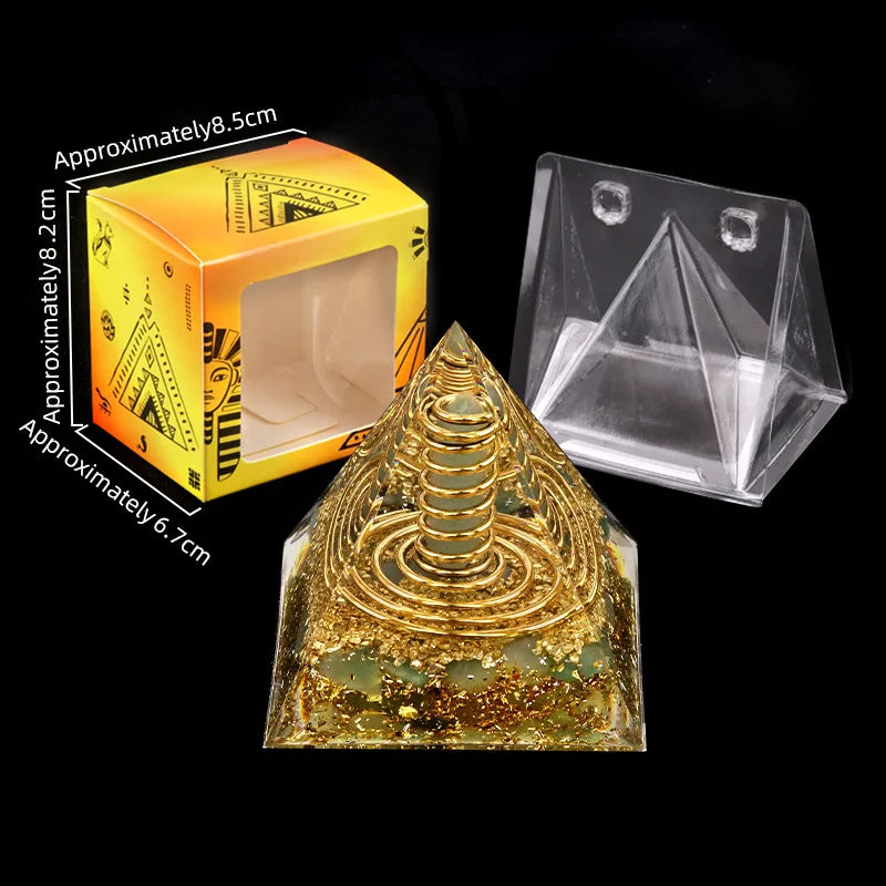 Gold pyramid with packaging and clear pyramid on a black background