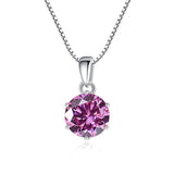 Pink gemstone pendant on a silver chain against a white background
