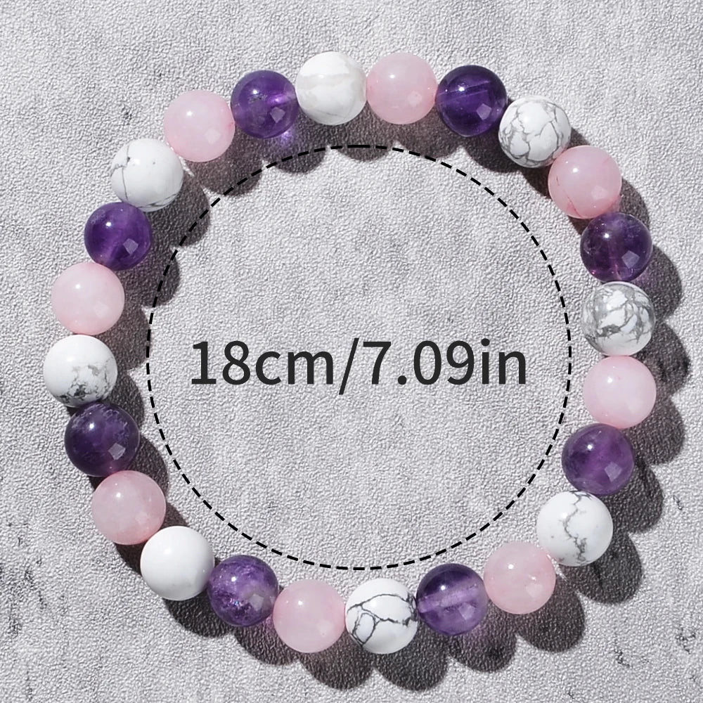 Beaded bracelet with measurement text on a gray background