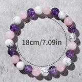 Beaded bracelet with measurement text on a gray background