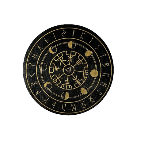 Round black coaster with gold symbols and text on a white background