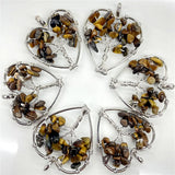 Set of six heart-shaped tiger eye pendants on a white background