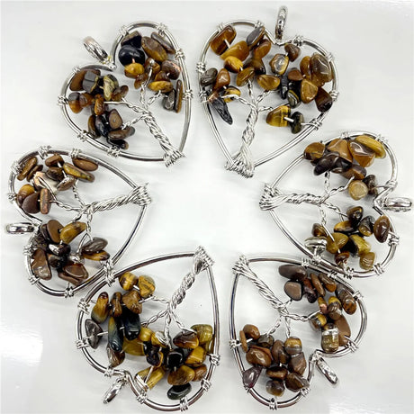 Set of six heart-shaped tiger eye pendants on a white background