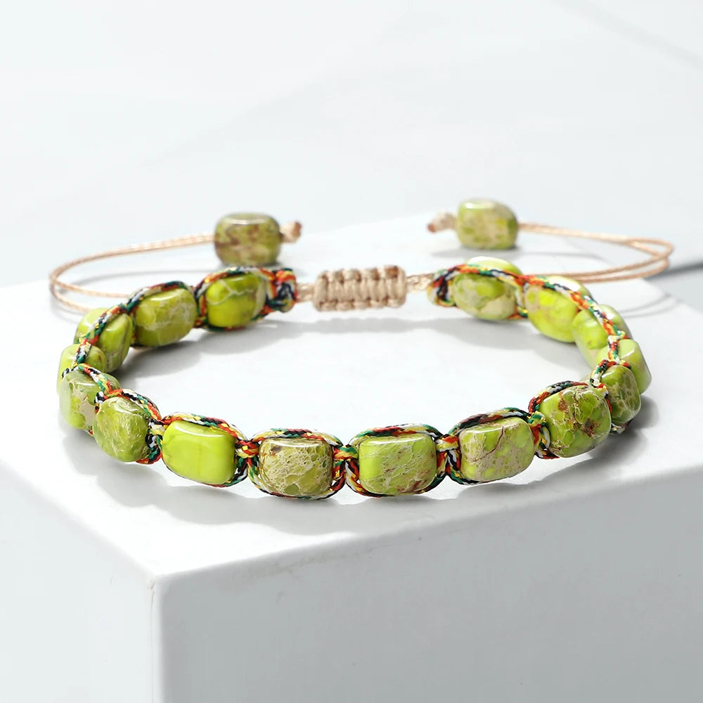Green beaded bracelet on a white background