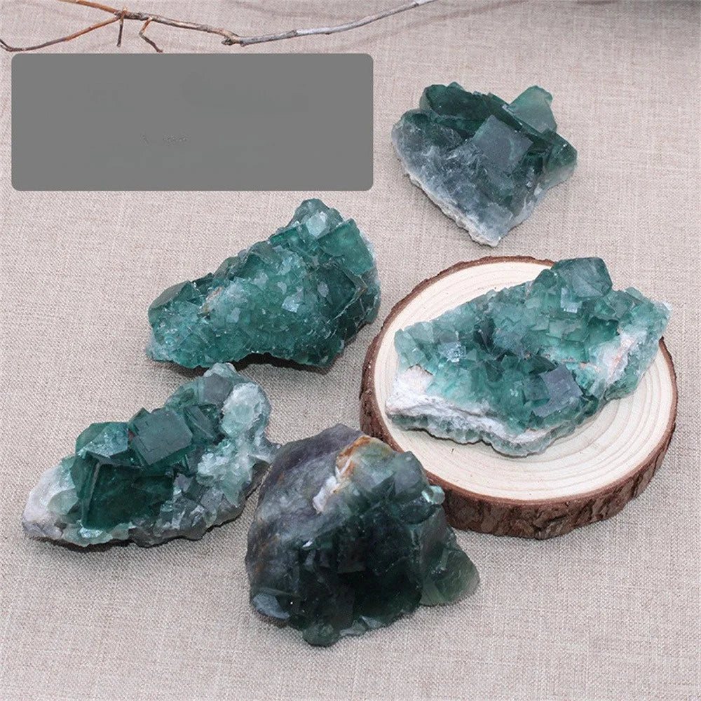 Green crystal rocks on a textured fabric background