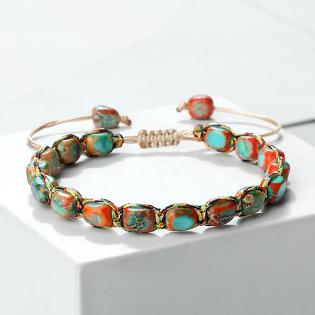Bracelet with colorful beads on a white background