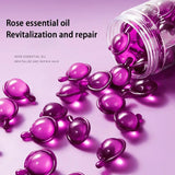 Purple essential oil capsules with a bottle on a pink background, labeled 'Rose essential oil Revitalization and repair'.