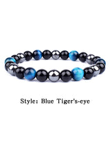 Beaded bracelet with blue and black stones on a white background