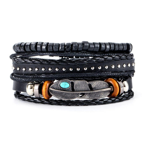 Black leather wrap bracelet with feather charm and turquoise stone on a white background