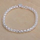 Silver bracelet on a wooden surface