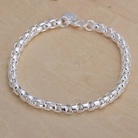 Silver bracelet on a wooden surface