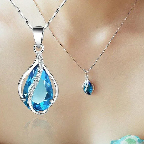 Blue teardrop pendant necklace on a mannequin