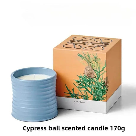Cypress ball scented candle with packaging on a white background