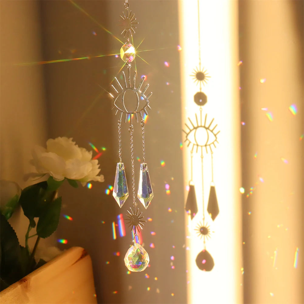 Decorative hanging crystal with rainbow, placed against a neutral background.