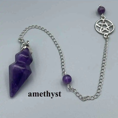 Amethyst crystal pendant on a silver chain with pentacle charm on a light gray background