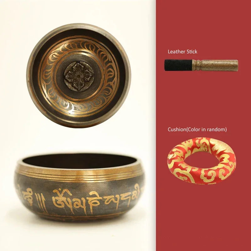 Tibetan singing bowl set with leather stick and cushion on a white background