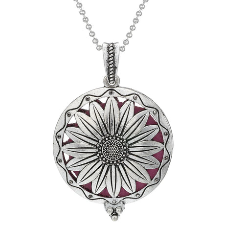 Silver pendant with floral design on a white background