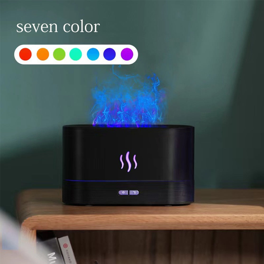 Black electronic device with colorful flame effect on a wooden surface against a green background