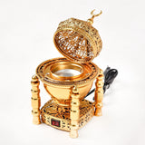 Decorative gold lantern with intricate designs on a white background