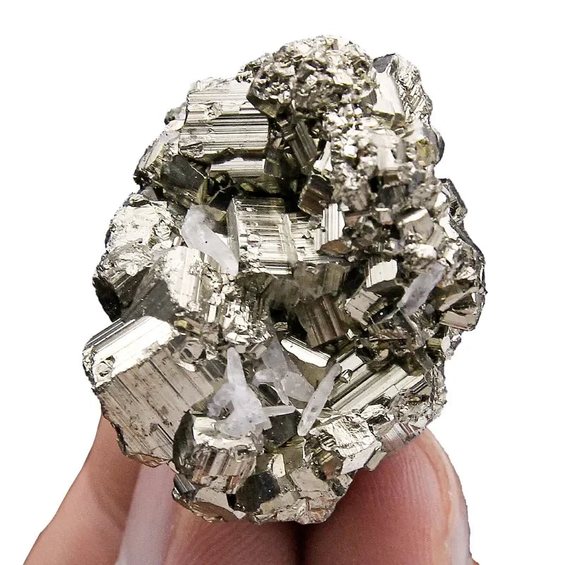 Mineral specimen held between fingers against a white background