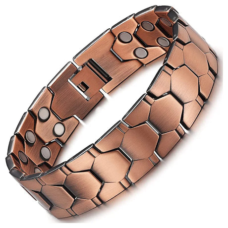 Copper bracelet with geometric pattern on a white background