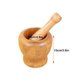 Wooden mortar and pestle with measurements on a white background