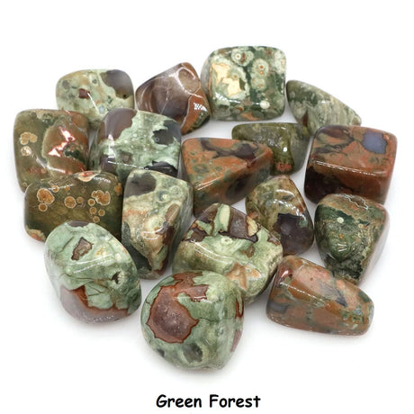 Collection of green and brown marbled stones on a white background