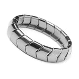 Silver ring with geometric design on a white background