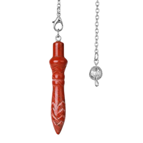 Red pendant with silver chain on a white background