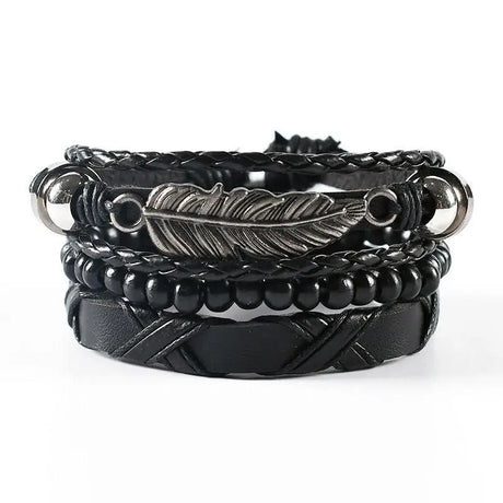 Black leather and metal bracelet with feather design on a white background