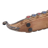 Wooden instrument with decorative elements on a white background