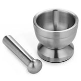 Stainless steel mortar and pestle on a white background